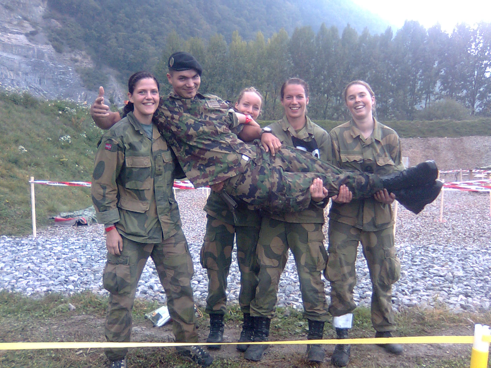 seargent sonderegger and a professional norwegian army squad at an international war game in the mountains near lake geneva